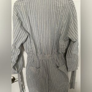 Three quarter sleeve blue and white stripe button down romper.